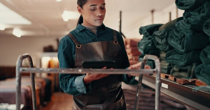 Tablet, leather workshop and woman on steps at shelf for fabric choice in small business. Tech, craft and person select tannery textile in factory for production, manufacturing and walking on ladder