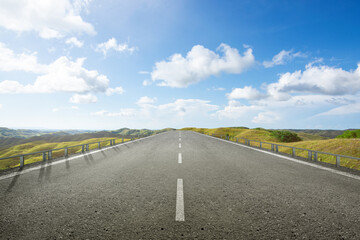Asphalt road with green grass