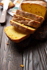 Homemade cornbread slices and butter on kitchen table