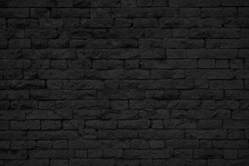 Old black brick wall texture. Grunge background