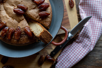 Sugar free cake with dates for natural sweetness on rustic background.
