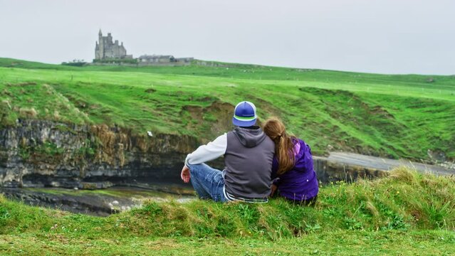 Couple Staring At Beautiful Classiebawn Castle In Distance - Ireland