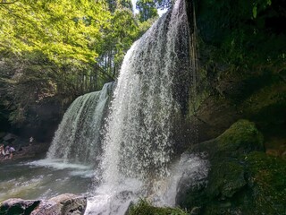 The Nabegataki Falls, where travelers can access the large cavern behind the falls