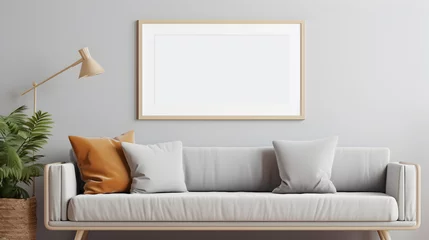 Fotobehang mockup cadre photo avec contour bois accroché à un mur de salon au dessus d'un canapé © Fox_Dsign