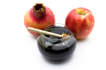 Honey , apple  and pomegranate jewish traditional symbols .Shofar , apple and pomegranate on white...