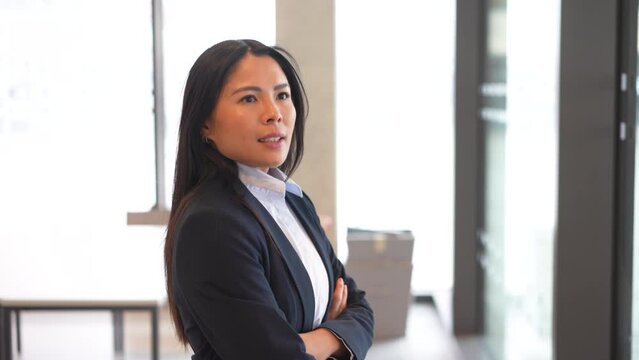 Confident businesswoman strides through hallway with determination