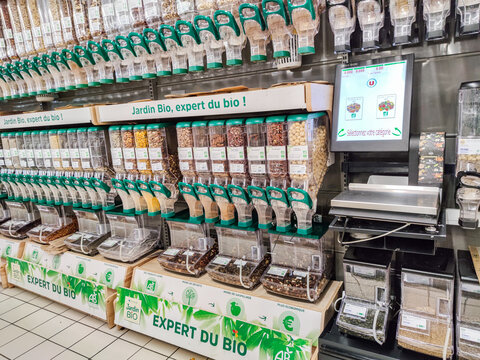 Closeup on Organic almond dispenser by "Jardin bio" brand in a French supermarket
