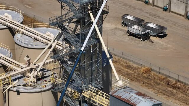 Aerial Sutter California rice elevator drying facility. Economy based on farming rice, grains, walnuts peaches and cattle ranch. Fields act as wetlands for waterfowl and birds.