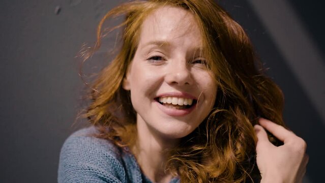 Radiant redhead smiling at camera