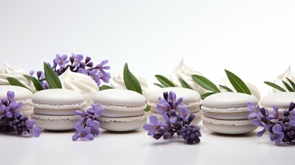 A row of macarons with white frosting and purple flowers. Fictional image.