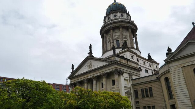 Tilt up shot of French Cathedral in Berlin on cloudy day, Germany