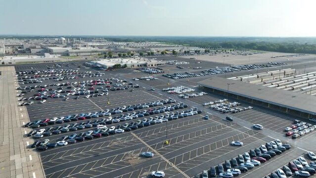 Car manufacturing plant. Aerial view parking lot full of new Toyota vehicles. Prius, Corolla, Tacoma, RAV4, Supra, Highlander, 4Runner, Sienna, and more models. Toyota Georgetown Assembly Plant.