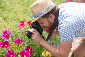 photographer taking photo of flowers