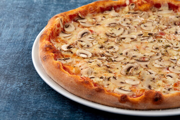 fresh pizza on the white plate
