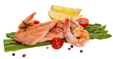 Grilled fillet of red fish (trout, salmon) with green asparagus, cherry tomatoes, shrimp isolated on a white background. Cooked seafood with pepper mix	