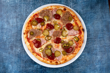 fresh pizza on the white plate