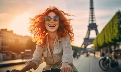 Photo sur Aluminium Tour Eiffel Cheerful Happy young woman riding bicycle in Paris near the Eiffel Tower, Travel to Europe, Famous popular tourist place in world.