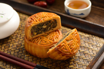Mid-Autumn Festival mooncakes on a retro background. The Chinese meaning on the mooncakes in the...