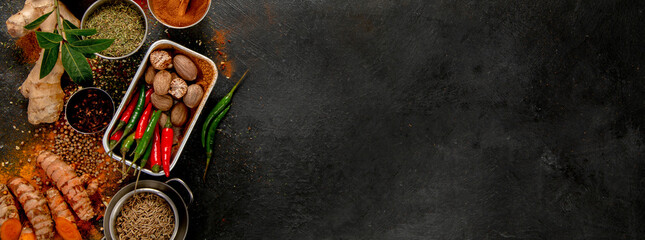 Spices on dark background. Different varius.