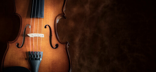 Violin on leather background with copy space for music concept or concert poster