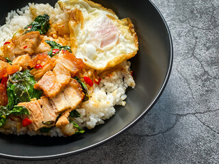 Rice topped with crispy pork belly with Thai basil and fried egg