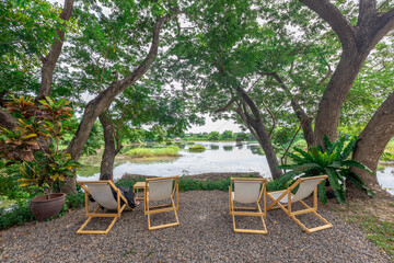 Background of wooden chairs or modern chairs that are placed in the interior of a restaurant or coffee shop for customers to sit while using the service.