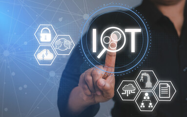 IOT Internet of things wireless technology concept. Hand pressing button on screen.Business technology, Software development concept.digital management, engineering technology