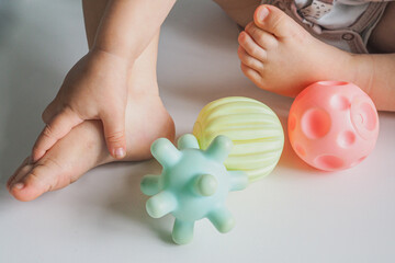 Baby foot and hand and colorful textured massage sensory soft balls