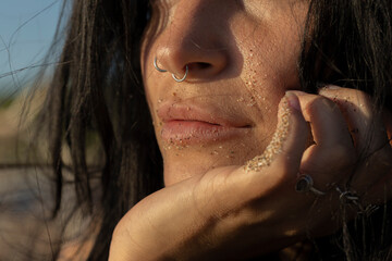 Female lips with sand
