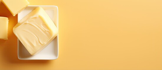 Fresh butter on isolated pastel background Copy space with clipping path