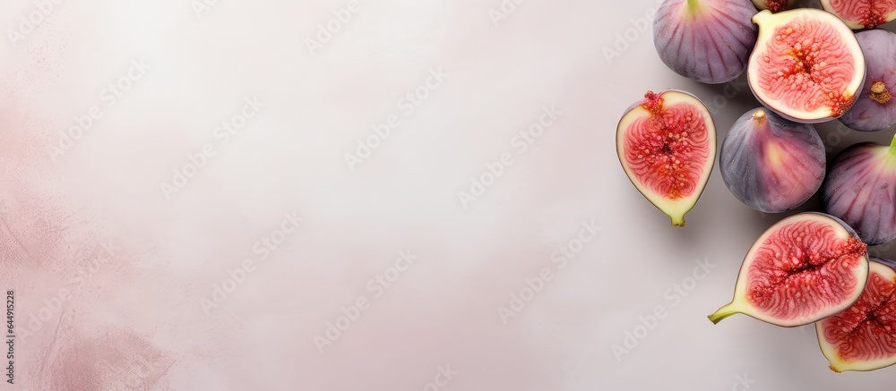 Poster half of fig fruits isolated on a isolated pastel background copy space