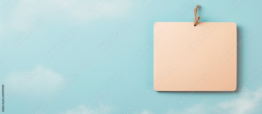 Aufkleber tag attached with string isolated pastel background copy space