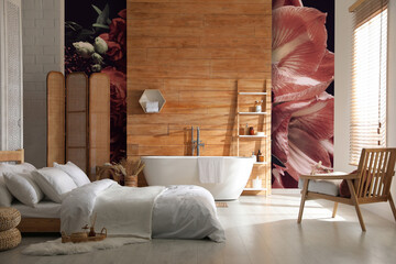 Stylish room interior with furniture, bathtub and beautiful floral wallpapers