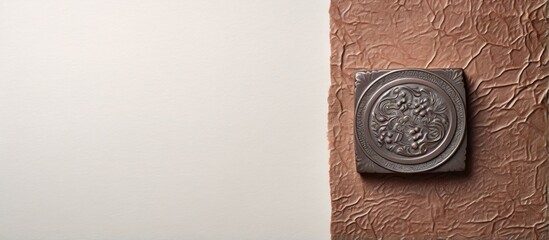 Ancient metal stamp on isolated pastel background Copy space