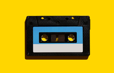 Obraz premium Audio cassette on a yellow background. View from above. Flat lay.
