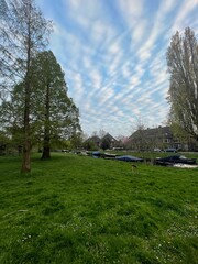 Canal with moored boats outdoors on spring day