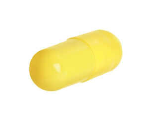 One yellow pill isolated on white. Medicinal treatment