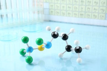 Molecular model on light blue glossy surface
