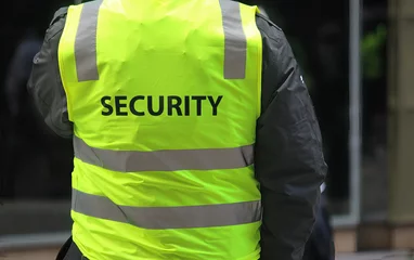 Foto op Canvas A security guard wearing a high vis vest © Rose Makin