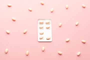 White pills package on pink background. Pharmaceutical package of antifungal tablets, antibiotic...