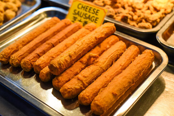 Fried cheese sausages in the street food Jalan Alor in Kuala Lumpur