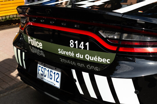 
Quebec City, Quebec, Canada, September 2, 2023 - Rear Of Sureté Du Québec National Police Force Parked Black Car With Small Rainbow Heart Sticker During The Gay Pride Weekend