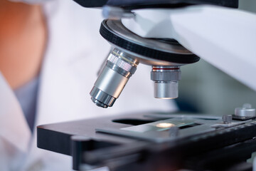 Close up of microscope in laboratory. Concept of science background, Research, chemist analysis. Substance experiment microbiology. Sample test and study. Technology science tool.