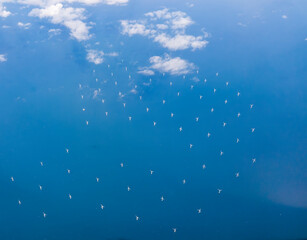 Looking down on an off-shore wind farm in the English Channel off the coast of Sussex, UK