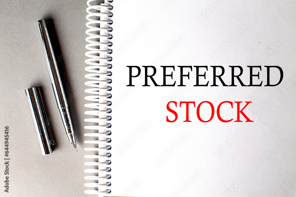 Poster preferred stock text on a notebook with pen on grey background