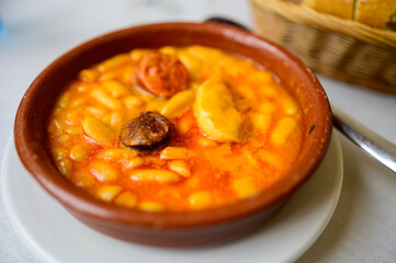 Fabada asturiana, Asturian bean stew, Spain, hot and heavy dish served with Asturian cider or...