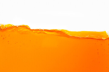 Macro orange juice texture isolated white background,Close-up Orange juice with bubbles on a white background.