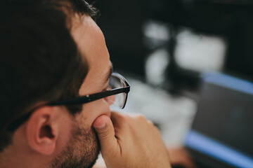 Portrait professional man programmer working concentrated on computer diverse offices. Modern IT technologies, development of artificial intelligence, programs, applications and video games concept