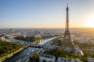 Fototapeta na wymiar Aerial view streets of Paris, France, overlooking the famous eiffel tower of paris at sunset..