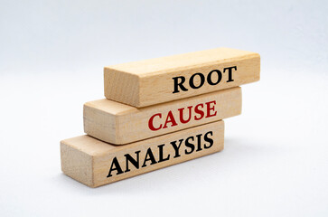 Root cause analysis text on wooden blocks